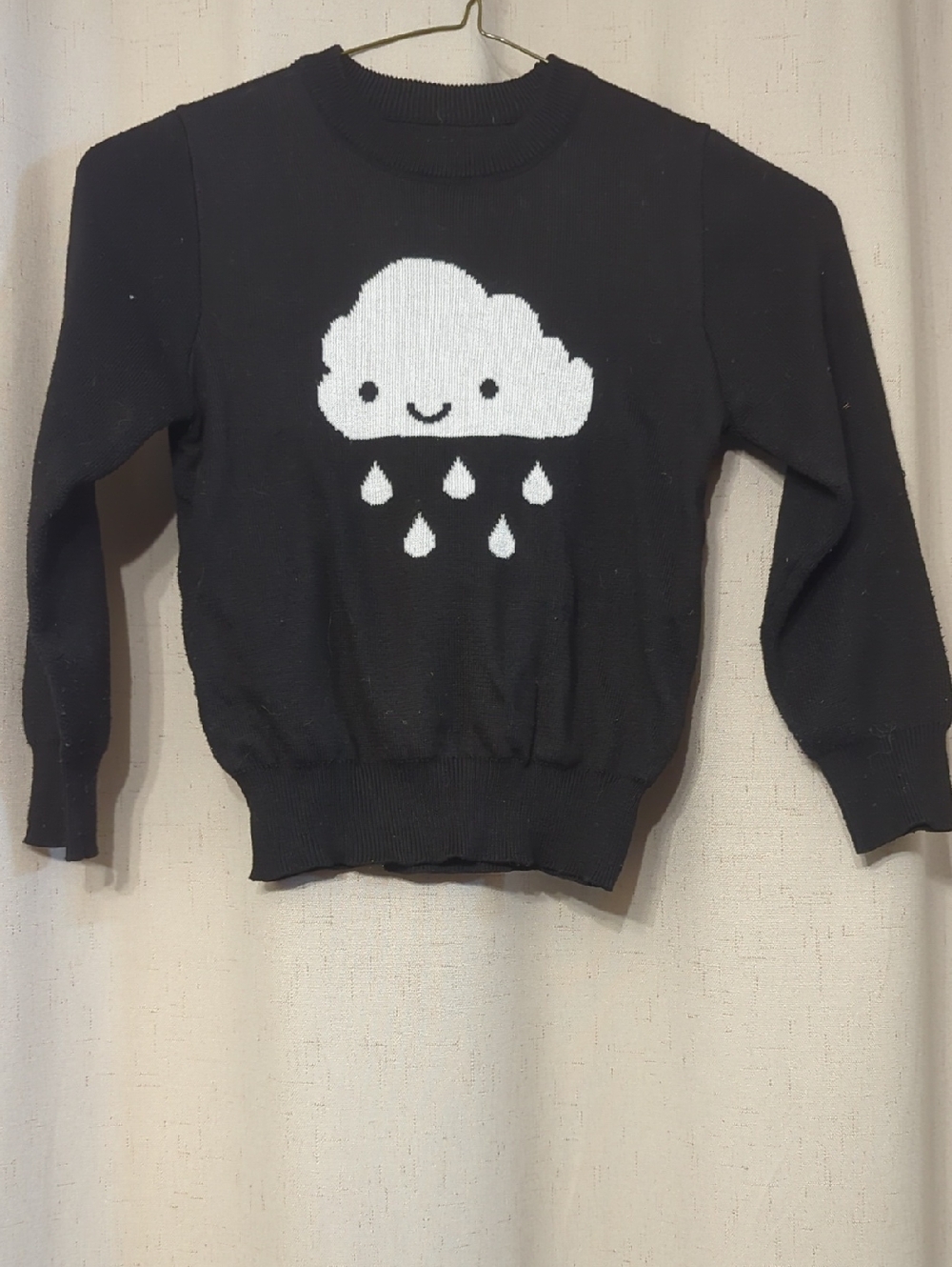 Black Sweater with White Smiling Cloud Graphic